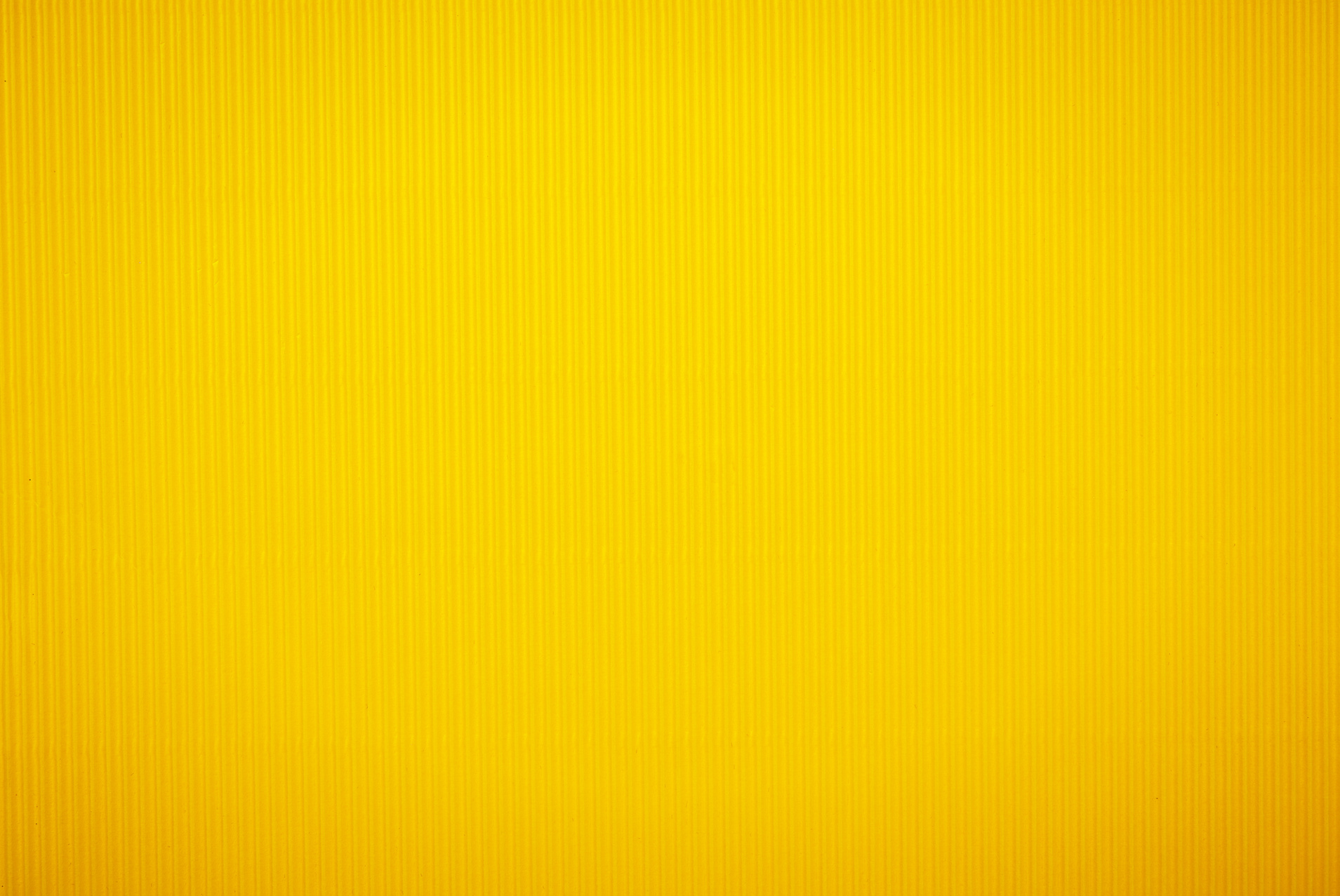 Background of bright yellow striped paper